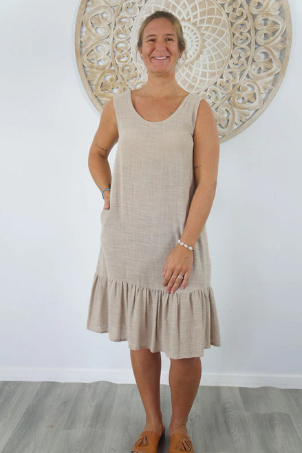 Sundrenched Shift Dress Stone
The Shift Dress in 100% cotton is a sophisticated and timeless addition to our collection.

 Crafted with the lightness of cotton, this dress offers a refreshing twist on the traditional resort attire.

Featuring side pockets and elastic underarm details, it provides a snug and comfortable fit.

 Available in two sizes: 8-12 and 14-18.