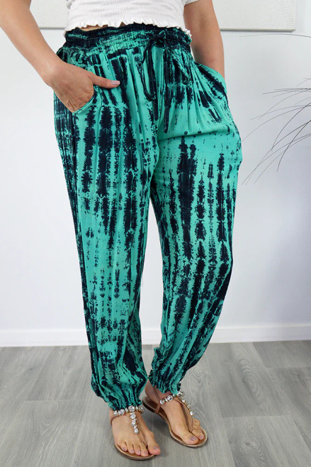 Gypsy Pant Teal
The gypsy pant is 100% rayon and one size to fit 10-16. With elastic/drawstring around the waist and elastic around the ankle, makes this stylish tie dye pant popular.

Please note that with ALL Tie Dye products there will be variations of colours as each garment has been individually dyed and may differ from the photos provided.

                           MEASUREMENTS

                                      
                                        10-16
LENGTH	                96cm
RELAXED WAIST	34cm
STRETCHED WAIST	50cm
