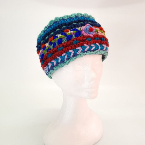 Headband Flower Turquoise
Woolen items with floral embroidery handmade in Nepal.

Inside of all are lined with soft fleece.

Free size. As these are handmade, sizing may vary.

The main background colour will be as per images however the colour of embroidery/stitching may vary.