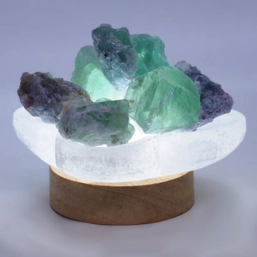 
Selenite Letters Fire Bowl With Rainbow Fluorite 
Rough pieces on Small LED Base

This purchase includes
– 1x Selenite Letters Bowl (10cm x 8cm x 2.5cm)
– 1x 250g Rainbow Fluorite
– 1x LED Light Timber Base with USB Cable – Small
– 1x 240V adapter

It can be powered by any device USB port or power point.

Simply place the Selenite bowl on the timber base.

The LED light base provides 3 Colour light mode
– Cool White Light
– Warm Light
– Natural Light

On/Off switch is attached at the cable and 8 level brightness adjustable, great for different light demands.

Timber Base Size: 7cm x 7cm x 2cm
Total Weight: 0.28kg