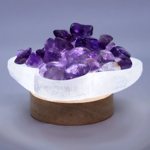 Selenite Letters Fire Bowl With Amethyst
Rough pieces on Small LED Base

This purchase includes
– 1x Selenite Letters Bowl (10cm x 8cm x 2.5cm)
– 1x 250g Rainbow Fluorite
– 1x LED Light Timber Base with USB Cable – Small
– 1x 240V adapter

It can be powered by any device USB port or power point.

Simply place the Selenite bowl on the timber base.

The LED light base provides 3 Colour light mode
– Cool White Light
– Warm Light
– Natural Light

On/Off switch is attached at the cable and 8 level brightness adjustable, great for different light demands.

Timber Base Size: 7cm x 7cm x 2cm
Total Weight: 0.28kg