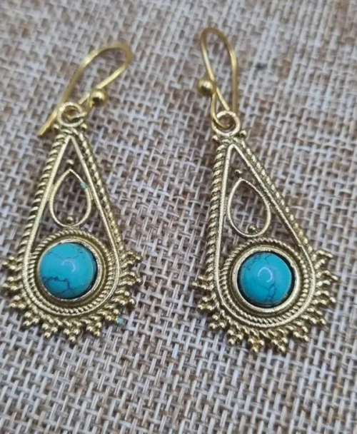 Teardrop Brass Earrings Turquoise 


Intricate brass earrings featuring vibrant turquoise stones in a delicate teardrop design. Lightweight and bohemian-inspired, perfect for adding an earthy statement to any look.

Brass is an alloy; it is a beautiful blend of copper and zinc, and it is nickel-free.
It possesses a natural, earthy yellow hue that looks remarkably like solid gold without the price!

All our brass jewelry is handmade in Rajasthan in North India