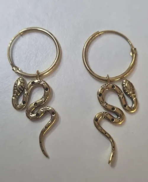 Teardrop Brass Earrings Snake


Intricate brass earrings featuring vibrant turquoise stones in a delicate teardrop design. Lightweight and bohemian-inspired, perfect for adding an earthy statement to any look.

Brass is an alloy; it is a beautiful blend of copper and zinc, and it is nickel-free.
It possesses a natural, earthy yellow hue that looks remarkably like solid gold without the price!

All our brass jewelry is handmade in Rajasthan in North India