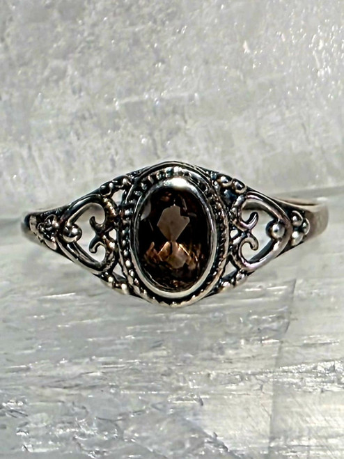 Smokey Quartz Sterling Silver Ring Size 9
Stone size .5 x .8 cm

Smoky Quartz - Great for anxiety & depression. Dissolving emotional blockage, clearing the mind, cooperation, grounding and centering, personal pride, joy in living, attentiveness to the moment, protection & also good luck. Used for kidneys, abdomen, pancreas, reproductive organs, menstrual cramps, fertility issues, water retention.