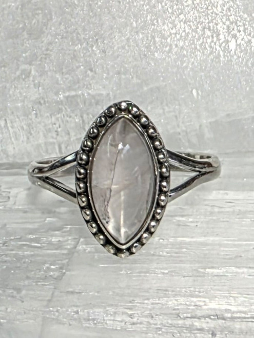 Rose Quartz set in Sterling Silver.
Size 8
Stone size 1.4 x .8 cm

Rose Quartz – Known as the Stone of Love. It is a stone for the heart as it opens the Heart Chakra. It teaches us about love on all levels, self-love, romantic love, love for all humankind. It can help draw in new love or relationships. It can strengthen a bond that already exists. It encourages self-forgiveness. It can help to heal a “broken heart.” Love of all kinds including self-love, protection during pregnancy and childbirth, peace, happiness, gentleness. Use for Emotional wounds, heart, the circulatory system, fertility, headaches, kidney disease, migraines, sexual dysfunction, sinus problems, throat problems, depression, addictions, earaches, slows signs of aging in general, reduces wrinkles, spleen problems, fibromyalgia, and reaching one's ideal weight / weight loss