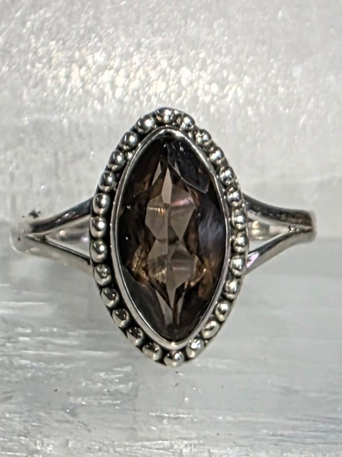Smokey Quartz Ring Size 9
Sterling Silver
Stone size approx 1.4 x .8 cm

Smoky Quartz - Great for anxiety & depression. Dissolving emotional blockage, clearing the mind, cooperation, grounding and centering, personal pride, joy in living, attentiveness to the moment, protection & also good luck. Used for kidneys, abdomen, pancreas, reproductive organs, menstrual cramps, fertility issues, water retention