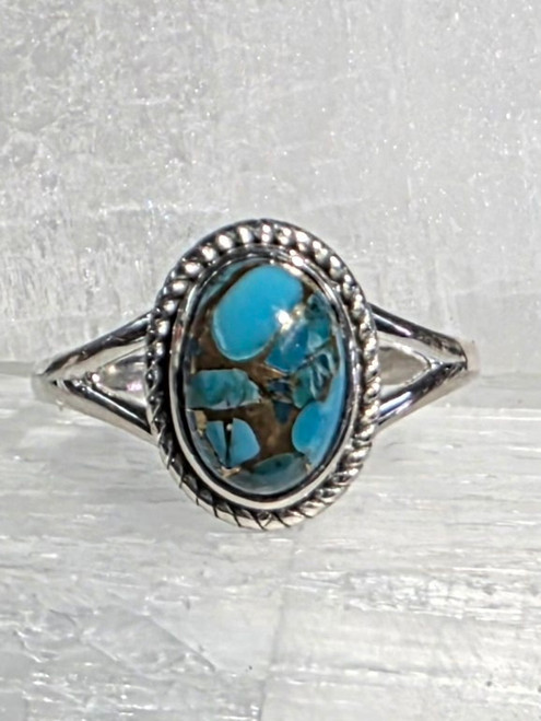 Blue Mohave Ring Size 10
Set in Sterling Silver
Stone Size Approx 1 x .8 cm

Turquoise – A beautiful gift from Mother Earth, Turquoise brings the blue of Father Sky to the Earth, blending together the energies of the heavens with the energies of the Earth. It is a healer of the spirit, providing a soothing energy which can bring peace and calm to the wearer. It is used by Native Americans as a protection stone.
Spiritual attunement, cleansing, communication, healing, protection, soothing, peace of mind, guidance through the unknown, romantic spontaneity.
"Master Healing Stone", prevents illness, bipolar disorder, panic disorder, all health issues in general.