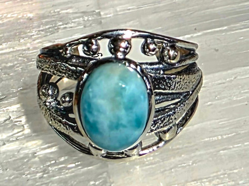 Larimar Ring Size 8
Set in Sterling Silver
Stone Size Approx 1 x .8 cm

Larimar- is sometimes called the stone of the Caribbean because of where it is found & also for its blue color. It is a most soothing and serene stone, able to calm and relax the emotions. It can bring peace and calm to any situation. It supports a state of wellbeing and reminds us that all is well. It is useful for the throat chakra, providing the power of clear communication. Also known as a Goddess Stone. It is useful for hot flashes, as it can bring a cooling, calm feeling. Also Throat, upper respiratory system, schizophrenia