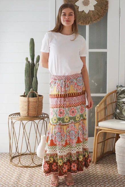 Dreamcatcher Maxi Skirt Jream
Wide elastic waistband with drawstring
Layered skirt with lace detail

100% Rayon

Material: 20% Nylon 80% Viscose 

Soft, smooth, and comfortable against the skin
Silky or luxurious touch due to the high viscose content
Excellent drape with a fluid, flowing appearance
Good luster (slight sheen)

Breathable and comfortable to wear
Good moisture absorption, helping keep the wearer cool
Suitable for warm and moderate climates

Stronger and more durable than 100% viscose because of the nylon content
Better abrasion resistance than pure viscose
Moderate wrinkle resistance, though wrinkles can still occur
Limited natural stretch unless elastane/spandex is added

Can lose strength when wet due to the viscose content
May shrink if washed or dried at high temperatures
Requires gentle care during washing and drying
Good color retention and dye uptake