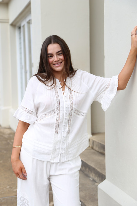 Salty Bright Top White
Stunning little spring top
Has button up front
3/4 Sleeve
Lace details at back, sleeves & hemline
Tie at back
100% rayon