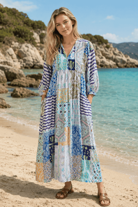 Quincy Patchwork Boho Long Dress Blue

100% Rayon Patchwork Boho Long Dress
Add effortless bohemian charm to your boutique collection with this beautifully crafted 100% rayon patchwork long dress. Designed for customers who love relaxed, feminine styling, this lightweight dress is perfect for spring/summer, holiday, and resort-inspired collections.
Made from 100% rayon, it offers a soft, breathable drape with a comfortable feel that is ideal for warm-weather dressing. Featuring a flattering V-neckline, relaxed tiered silhouette, balloon sleeves, and functional side pockets, this dress combines style with everyday practicality.
The vibrant mixed-print patchwork design creates a standout statement piece while remaining easy to merchandise across coastal, boutique, and boho fashion ranges.
Key Features
100% rayon for a soft, lightweight, and breathable feel.
Eye-catching mixed-print patchwork design.
Relaxed tiered mini dress silhouette.
Flattering V-neckline with decorative trim detailing.
balloon long sleeves with elastic cuffs.
Functional side pockets.
Comfortable, flowy fit for all-day wear.
Perfect for spring/summer, holiday, and resort collections.