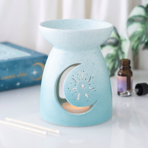Oil Burner Blue Moon
Add a dreamy celestial touch to your home with this Blue Pastel Skies Moon Cut Out Ceramic Oil Burner. Featuring a soft pastel blue finish and an elegant moon cut-out design, this ceramic oil burner combines fragrance and style seamlessly. Suitable for use with fragrance oils, it creates a calming atmosphere in bedrooms, living rooms, and relaxation spaces. A perfect gift for birthdays, housewarmings, or anyone who adores moon-themed accessories, celestial home decor, and aromatic ambiance. This piece is part of the Pastel Skies collection, offering a range of celestial gifts and home decor items.

Product Size: H13.2cm x W10.2cm x D10.2cm