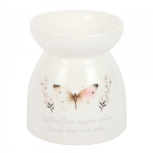 Oil Burner Butterflies Appear
This elegant white ceramic oil burner boasts a soft grey butterfly design and a heartfelt message, 'Butterflies appear when loved ones are near', creating a soothing ambiance in any space. Simply add a few drops of your favourite diluted fragrance oil to the top and place a tealight below to gently scent the room, offering a peaceful moment of reflection. It is recommended to use fragrance oil diluted with water; never use undiluted oil. Always remember to never leave a lit candle unattended. This oil burner is part of the White Butterfly collection, a range of sentimental gifts and home decor items.

Product Size: H10.5cm x W10.1cm x D10.1cm