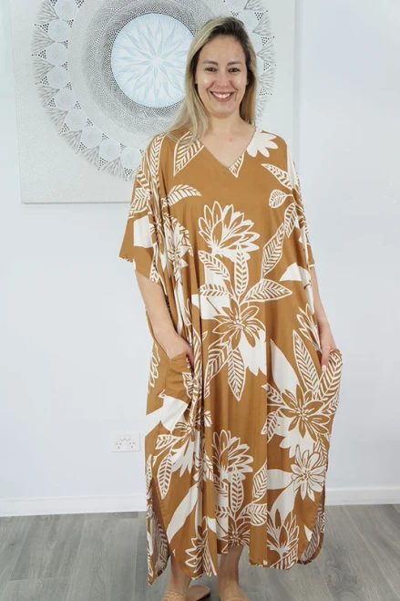 Premium Kaftan Taupe
The Long Kaftan is Sundrenched's signature item. After 25 years of perfecting the long kaftan, we have the most affordable, high quality kaftan on the market. This garment is 100% rayon making it breathable and incredibly soft.

Added Side Pockets make this a versatile garment for around the house and for outdoor activities.

Our kaftans range from rich solid colors to funky patterns. A simple v-neck in the front, side splits on the bottom and a free size from 10-26, this product fits everyone (seriously, these fit everyone). 

Overall width is 90cm and overall length is 125cm.
