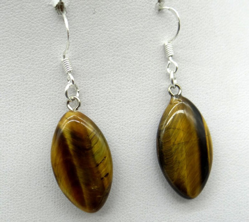 Stone Earrings Tiger Eye
Tiger Eye - A stone which resonates with the Earth Energies. A grounding stone that can help bring stability to the wearer. Self-discipline, practicality, protection, peacefulness, clarity, intelligence, intuition & psychic powers, new experiences, financial stability, calmness, releasing inhibitions, integrity, willpower, prosperity, personal power, kundalini. Heal wounds, bruises, colon, digestion, stomach problems, eyes, night vision, reduce pain, alcoholism, reproductive system. A useful stone for those seeking clarity around unresolved issues or decisions. Good for protection & travel. It resonates with the solar plexus chakra ( 3rd Chakra).