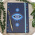 All Seeing Eye A5 Notebook with Crystal Pen
Crystal Lapis
"The All-Seeing Eye," also known as the "Evil Eye," is a powerful and universally recognised symbol of protection. It is believed to shield against negative energies, envy, and misfortune, offering a sense of security and peace. This ancient belief, shared by many cultures, suggests that the human gaze can possess an unseen power, and thus, the Evil Eye becomes a talisman to protect against any malevolent forces. We are delighted to showcase this captivating Evil Eye print design on our A5 Notebooks, complete with a complementary crystal pen, adding an air of mystery and enchantment to your writing adventures.

H21cm x W16.4cm x D1.3cm
