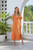 Mutig Midi Dress Orange
V-Neck Loose-fit Midi Dress
Loose-fit midi dress
V-neck
Front button detail
Fabric: 100% Cotton