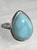 Ring Teardrop Larimar Size 8
Set in Sterling Silver 
Stone size approx 1.5 x 2cm

Larimar- is sometimes called the stone of the Caribbean because of where it is found & also for its blue color. It is a most soothing and serene stone, able to calm and relax the emotions. It can bring peace and calm to any situation. It supports a state of wellbeing and reminds us that all is well. It is useful for the throat chakra, providing the power of clear communication. Also known as a Goddess Stone. It is useful for hot flashes, as it can bring a cooling, calm feeling. Also Throat, upper respiratory system, schizophrenia
