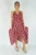 Sundrenched Festive Dress Blossom Red
The Festival dress, simplicity at its best.
Featuring a V neckline front & back, elastic easements under the arms which ensures an comfortable fit. Side pockets and a handkerchief styled hemming to suit any body shape.
ONE SIZE TO FIT 10-18

 MEASUREMENTS

LENGTH	85cm
BODY	        70cm
