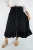 Sundrenched Tangelo Skirt Black
The Tangelo Skirt offers a playful and charming look. Its "hi-low" design gives it a versatile length ideal for both casual outings and dressier occasions.

The elastic smocked waistband provides a comfortable fit that accommodates sizes 8 to 16 with ease.