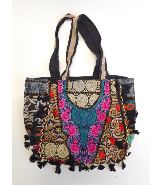 Embroidered Tote Bag Black
This colourful, large cotton tote bag made in India is beautifully adorned with intricate embroidery and playful tassels, showcasing traditional craftsmanship. It is spacious and perfect for carrying everything you need for daily use or a weekend getaway.

- The base colour will be as shown in images, however the designs and patterns will vary, allowing each piece to be unique.

- 1 main zip compartment and 1 inner zip compartment

- Width: 53cm approx

- Length: 40cm approx