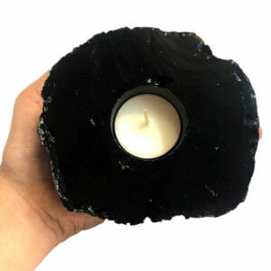 Obsidian Tealight Candle Holder

Actual product may vary in shape, weight and colour as they are individually hand-crafted from 100% Obsidian making your purchase unique.

Approx Weight	0.78 kg
Approx	12 × 10.5 × 4 cm

Obsidian - Obsidian is a glassy, volcanic stone. It eliminates negative energies in one self and one’s environment. It is a strong grounding stone, assisting us in connecting with the Earth energies. It offers a protective energy and can help us to remove negative thoughts and mental habits so a more positive action can be taken. For clarity, deflecting negativity, protection, healing, grounding. Use to release buried emotions causing illness, stomach, intestines, muscle tissue, bacterial infections, viral infections. 