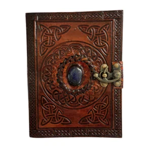 Leather Journal 1 Stone
Our leather journals are beautifully printed with a range of powerful symbols. Inside, textural pages are made from handmade paper, that has been recycled from excess cotton used in the textile industry. The journal is finished with a brass clasp, perfect for keeping all those journal entries safely tucked away!

Made in India Exquisitely hand printed leather with all recycled paper inside.
3 beautiful stones & a clasp closure
Size: 15cm x 20cm

Material: Leather cover with stones and recycled paper pages