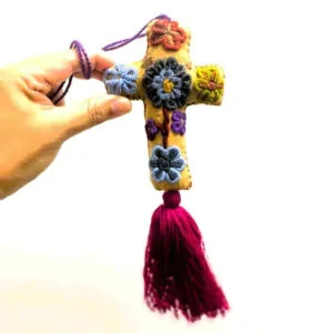 Mexican Sugar Cross 
Add a touch of genuine Mexican artistry to your store’s offerings with these exquisite handcrafted crosses from the Chiapas Region of Mexico. Each piece is made by skilled artisans, featuring vibrant embroidery and intricate details that capture the rich cultural heritage of Mexico. The bold colours and unique design make it a standout accessory-perfect as a meaningful religious gift, a stylish bag charm, or a distinctive home decoration.

Every cross is unique, reflecting the care and skill poured into its creation, making it a special keepsake for anyone who appreciates genuine handmade artistry.