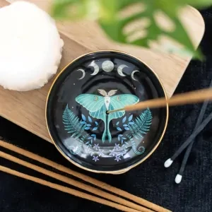 Ceramic Incense Holder – Luna Moth

Practical and stylish, this gorgeous incense plate features an enchanting luna moth and moon phases design. The plate is thoughtfully designed to accommodate both incense sticks and cones, featuring a small hole in the center for sticks and a flat, stable surface suitable for burning cones.
Approx H2cm x W9cm x D9cm