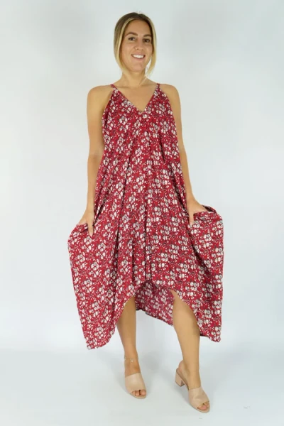 Sundrenched Festive Dress Blossom Red
The Festival dress, simplicity at its best.
Featuring a V neckline front & back, elastic easements under the arms which ensures an comfortable fit. Side pockets and a handkerchief styled hemming to suit any body shape.
ONE SIZE TO FIT 10-18

 MEASUREMENTS

LENGTH	85cm
BODY	        70cm
