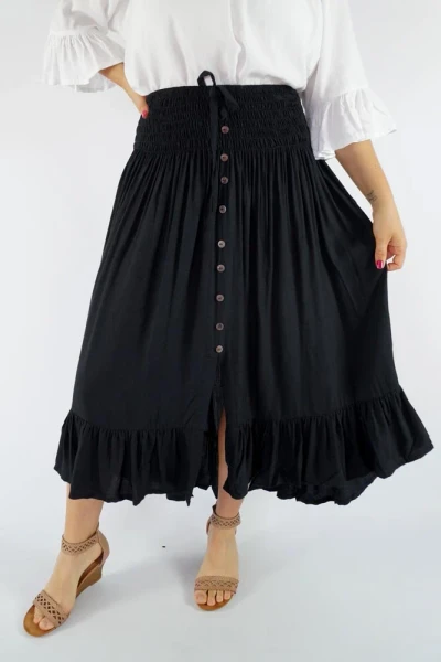 Sundrenched Tangelo Skirt Black
The Tangelo Skirt offers a playful and charming look. Its "hi-low" design gives it a versatile length ideal for both casual outings and dressier occasions.

The elastic smocked waistband provides a comfortable fit that accommodates sizes 8 to 16 with ease.
