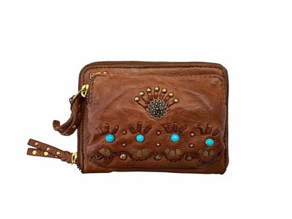 Art N Vintage Jasri Wallet Oak
Embellished with brass & turquoise studs
1 zip compartment holding 10 card holders and 2 money sleeves
1 outer zip compartment for coins etc
Approx 16 x 10 x 4cm
Art N Vintage leather bags are made from raw cowhide leather and each finished piece is dip dyed, dried, tumbled and hand finished to achieve a unique vintage look with natural markings.
