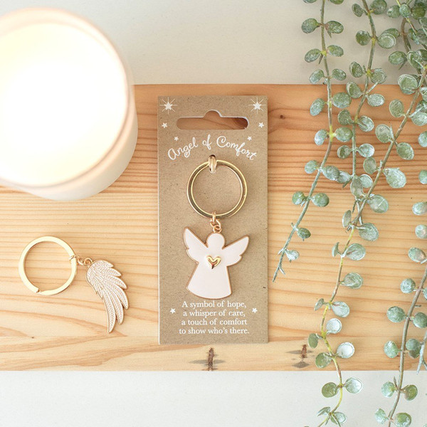 Key Ring Angel of Comfort
Carry a small symbol of comfort with you wherever you go with this elegant white angel keyring, featuring metallic gold edging and a delicate heart detail. Presented on a matching Angel of Comfort backing card with a thoughtful sentiment, it serves as a meaningful and easy-to-give keepsake. This item is part of the Guilded Wings collection, which offers a range of angel-themed gifts and accessories.

Product Dimensions: H7.3cm x W3.3cm x D0.2cm