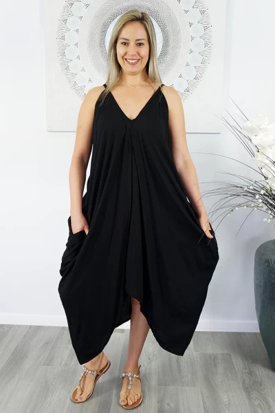 Festive Dress Black
A simple but comfortable day dress. This rayon garment features a v-neck line on front and back, elastic easements under the arms for an easy fit, side pockets and a handkerchief styled bottom hem.

ONE SIZE TO FIT 10-18