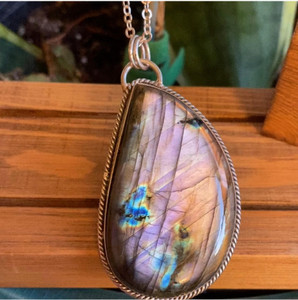Unveil the beauty of this remarkable Necklace, featuring a captivating Purple Fire Flash Labradorite Pendant, its open back design enhancing its healing properties for a truly special accessory. Unveil the beauty of this remarkable Necklace, featuring a captivating Purple Fire Flash Labradorite Pendant, its open back design enhancing its healing properties for a truly special accessory.