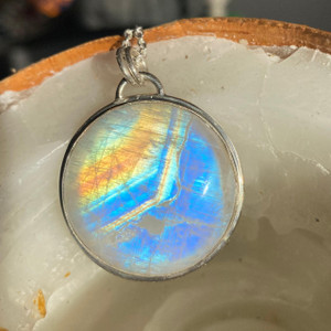 "Sterling silver pendant necklace with Natural Rainbow Moonstone cabochon statement - Embrace celestial beauty!" "Sterling silver pendant necklace with Natural Rainbow Moonstone cabochon statement - Embrace celestial beauty!"