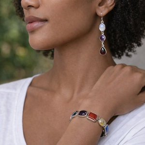 Artisan-made sterling silver earrings with cascading moonstone, amethyst, and garnet cabochons in bezel settings