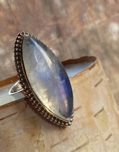 "Shop-Moonstone statement ring with marquise gemstone and blue flash." "Shop-Moonstone statement ring with marquise gemstone and blue flash."