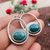 Handmade turquoise earrings featuring blue moon oval stones set in sterling silver Navajo hoops, elegant boho jewelry