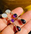 long multi-gemstone dangle earrings with oval moonstone, round amethyst, and teardrop garnet crystals in sterling silver