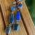 Sterling silver Labradorite waterfall earrings with three linked faceted stones in a modern geometric design.