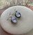 Sterling silver moonstone drop earrings featuring round stones and decorative beaded bezel