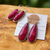 Faceted ruby gemstone earrings with pink stones in long dangling bar and teardrop design