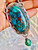 "Discover elegance with our Chrysocolla and Malachite pendant necklace, featuring a vintage-style bezel setting." "Discover elegance with our Chrysocolla and Malachite pendant necklace, featuring a vintage-style bezel setting."