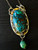 "Shop now for our Chrysocolla with Malachite pendant necklace, a stunning statement piece in teal blue-green hues!" "Shop now for our Chrysocolla with Malachite pendant necklace, a stunning statement piece in teal blue-green hues!"