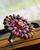 "Handcrafted two tone large gemstone ring featuring natural pink ruby in a floral design"