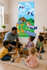 Noah’s Ark Bible story wall decal displayed in a preschool Sunday school classroom with children and teacher playing with toy animals.