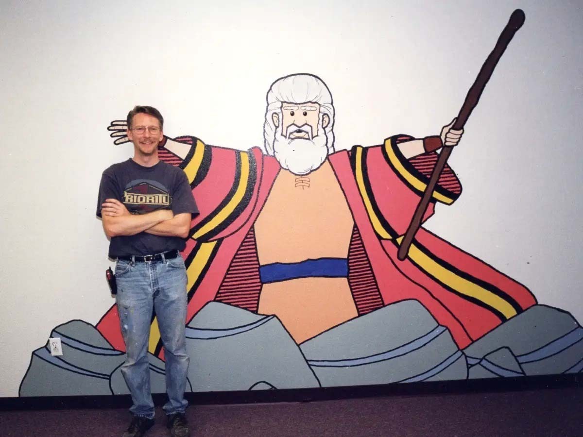 Randy painted his first mural — Moses Parting the Red Sea — in Michele’s children’s ministry