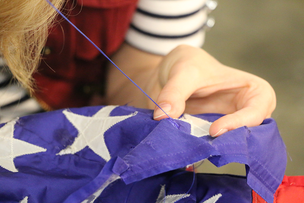 Sewing the star on an American Flag