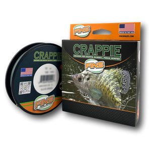 FINS US Made Crappie Fishing Braid closeup of box and roll sitting next to box FINS US Made Crappie Fishing Braid closeup of box and roll sitting next to box
